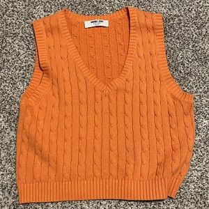 Orange sweater vest